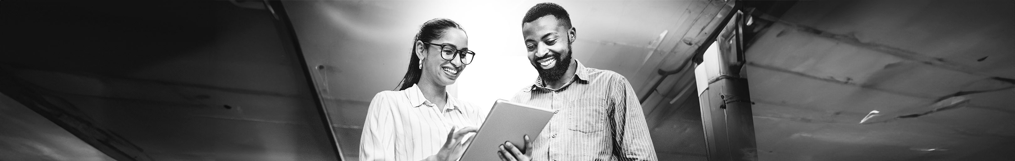 SINGLE-IMAGE_two-employees-with-laptop_apr24