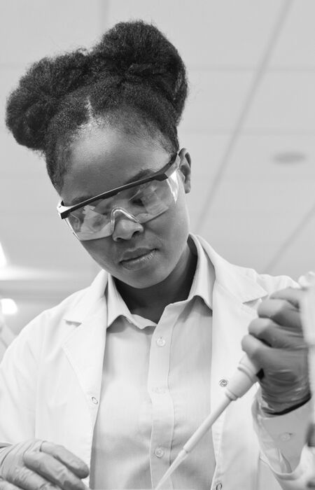 SINGLE-IMAGE_squares-young-female-scientist-filling-chemical-through-pipette_mar25